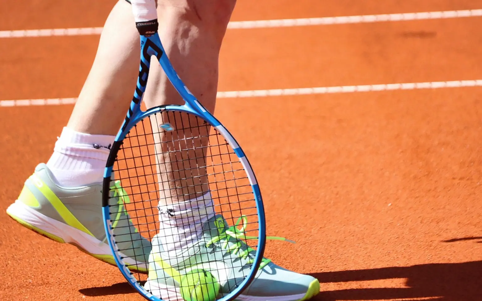 Tennis ball, tennis player and tennis racket